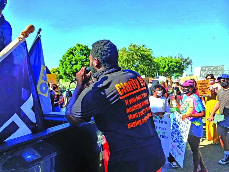 Protesters “paint Seal Beach black” for a day