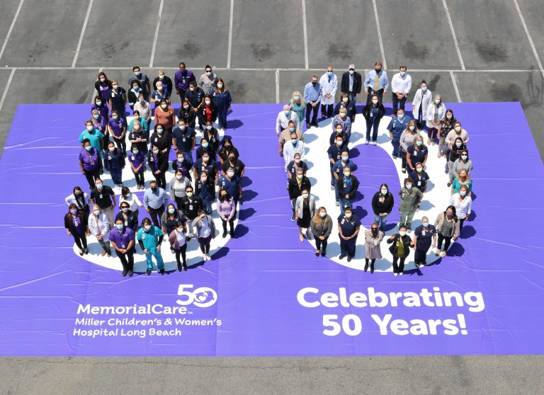 Long Beach gather in the shape of a giant 50 in honor of the hospital’s 50th anniversary.