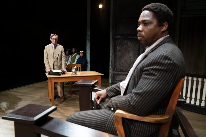 Richard Thomas as Atticus Finch on the Segerstrom stage with Yaegel T. Welch as Tom Robinson, shown on the stand during his dramatic trial. TKAM stage photos by Julieta Cervantes.