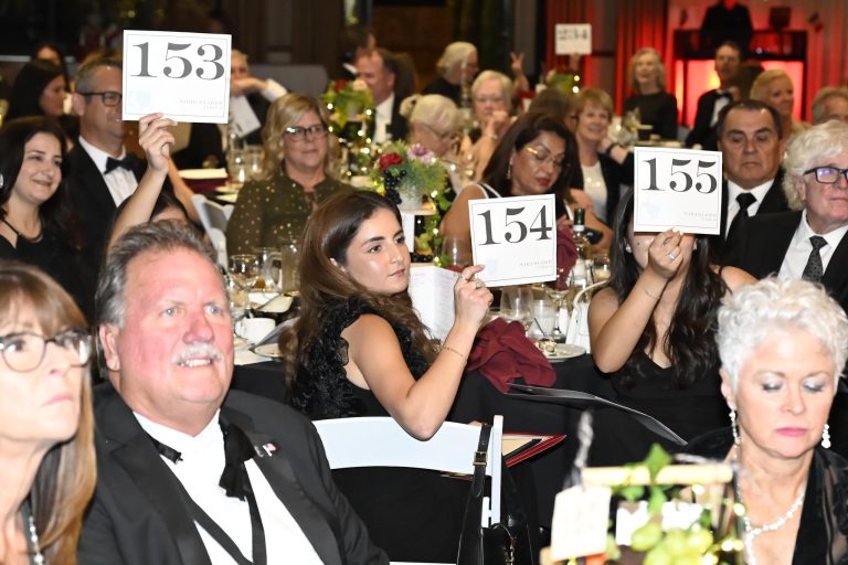 Helping hands across generations reach out with generosity at Youth Center Crystal Hearts Ball